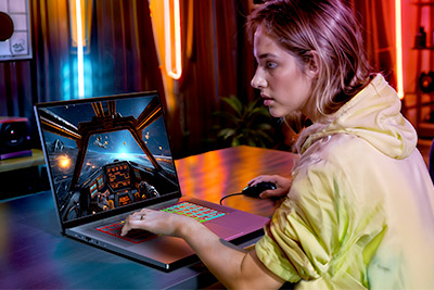 Young woman gaming on Chromebook